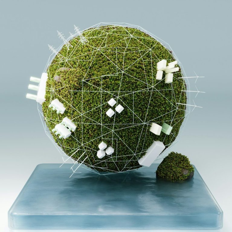 Grüner, stilisierter Globus aus Moos und geometrischen Formen auf einem glatten Untergrund.